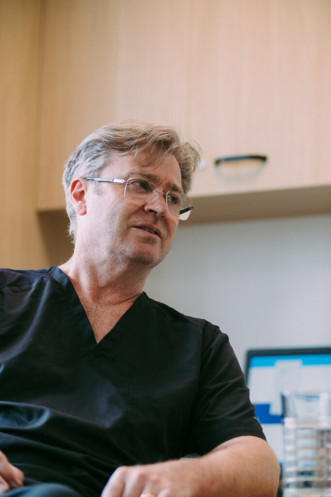 Surgeon,Talks,To,Patient,In,Clinic,Room,For,Follow-up,Appointment
